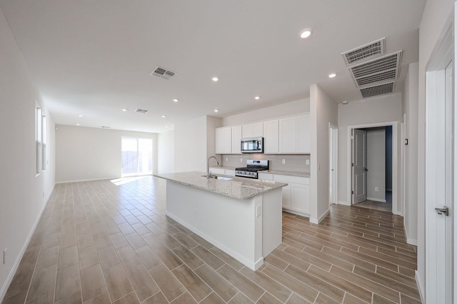 A kitchen with white cabinets. A kitchen with white cabinets.