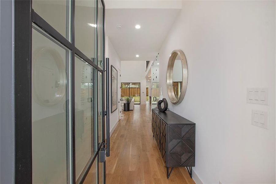 Hallway with light wood-type flooring