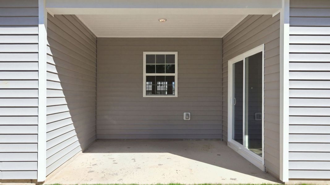 Exterior details and patio area of a home in Tyler - Home on the Lake, New Bern (Image 21).