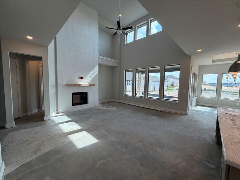 Family Room with soaring ceiling & fireplace
