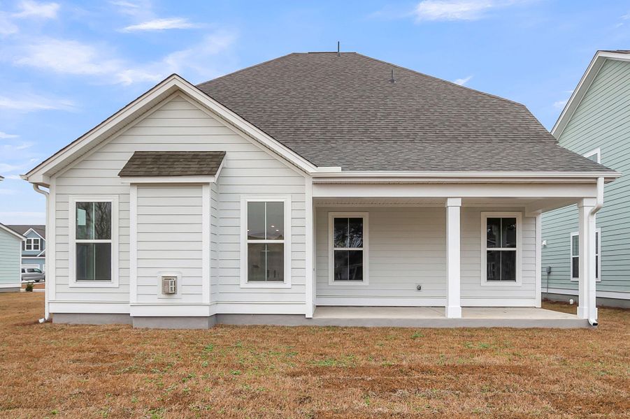 Exterior details and patio area of a home in Tidewater at Lakes of Cane Bay, Summerville (Image 3).