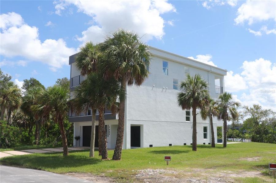 Front exterior of a new home in , Port Richey, FL, highlighting curb appeal (Image 2).