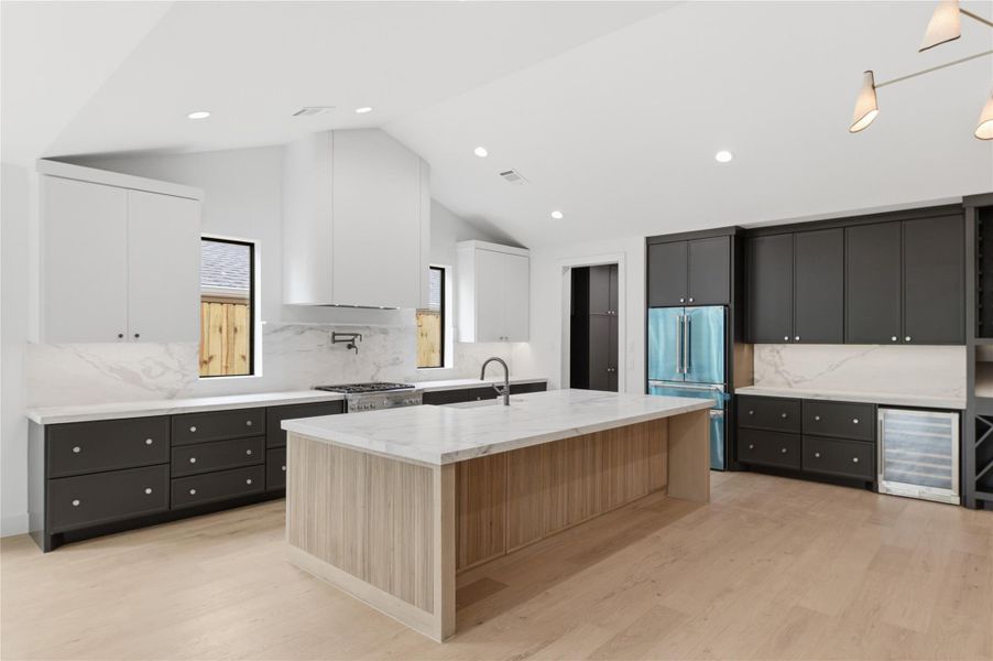 The expansive open-concept layout seamlessly connects the living, dining, and kitchen areas—perfect for both everyday living and entertaining.