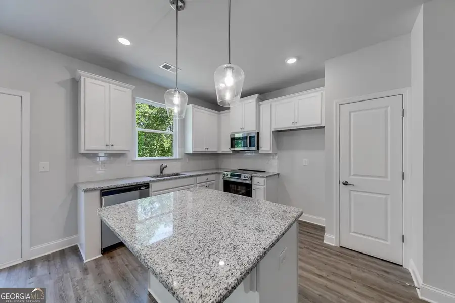 Furnished interior view inside a new home in Chimney Oaks Townhomes, Homer (Image 4).