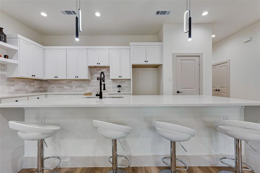 Kitchen featuring decorative light fixtures