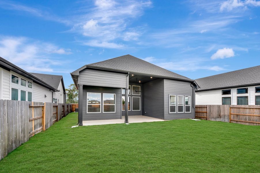 Exterior details and patio area of a home in ARTAVIA - Enclave Collection, Conroe (Image 26).