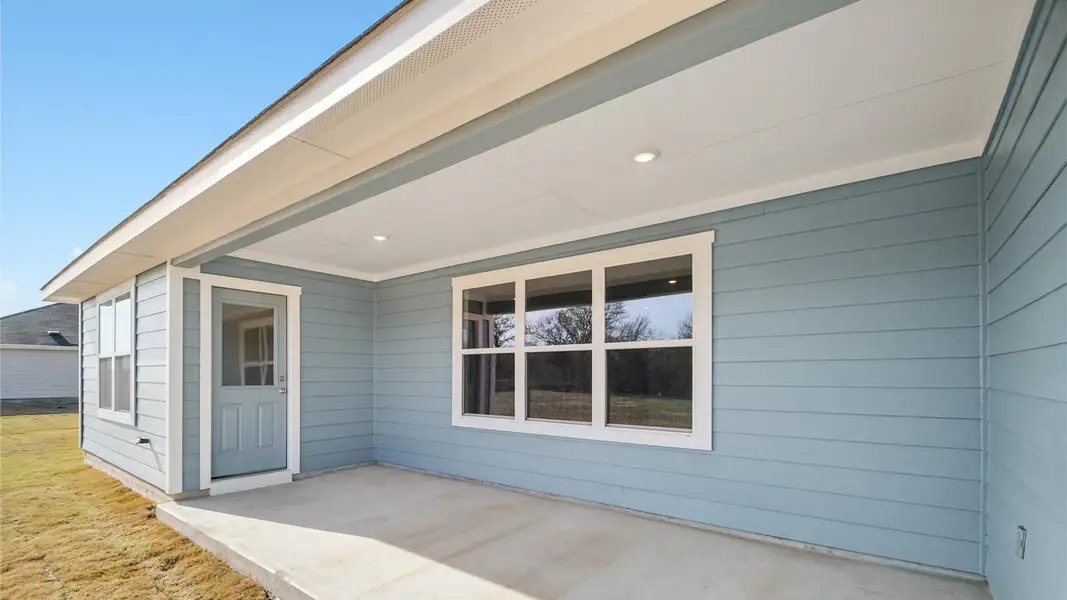 Exterior details and patio area of a home in Railhead, Cedar Creek (Image 3).