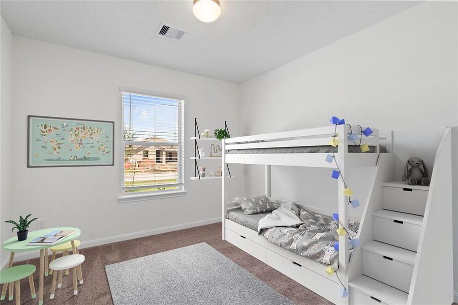 Secondary bedroom features plush carpet, and a large windows with privacy blinds.