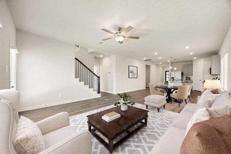 Gather the family and guests together in your lovely living room! Featuring high ceilings, ceiling fan with lighting, custom paint, gorgeous floors, access door to the back yard, and large windows that provide plenty of natural lighting throughout the day. *Virtually Staged Gather the family and guests together in your lovely living room! Featuring high ceilings, ceiling fan with lighting, custom paint, gorgeous floors, access door to the back yard, and large windows that provide plenty of natural lighting throughout the day. *Virtually Staged