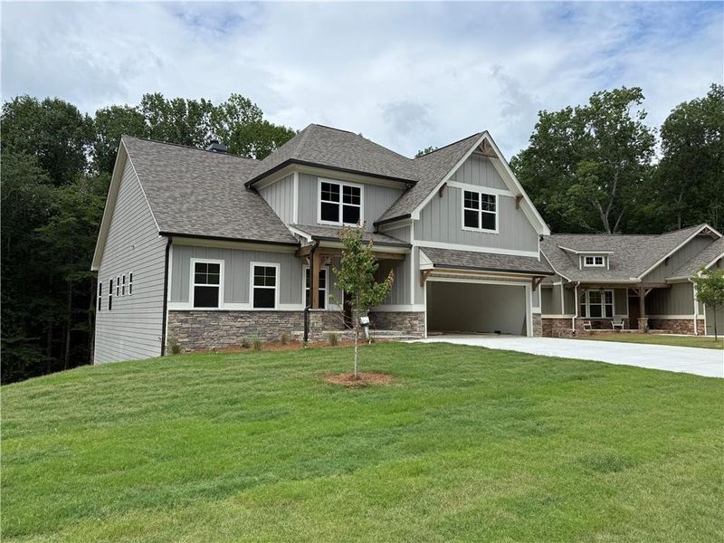 Front exterior of a new home in , Waleska, GA, highlighting curb appeal (Image 2). Front exterior of a new home in , Waleska, GA, highlighting curb appeal (Image 2).