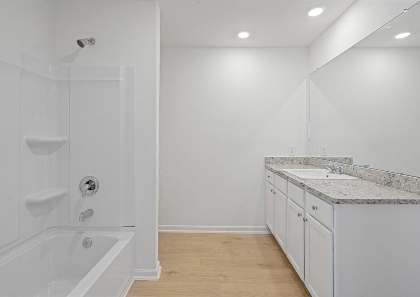 A large granite vanity in the master bathroom