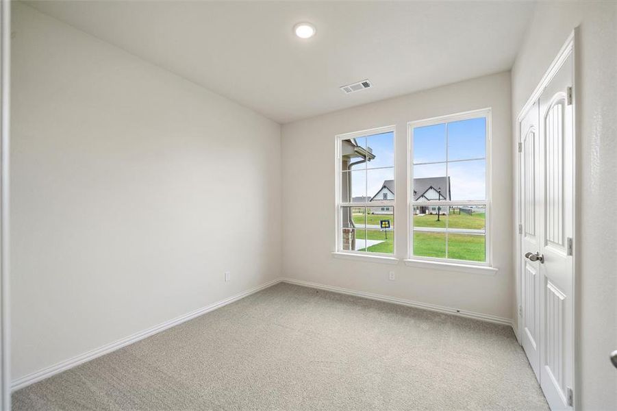 Unfurnished room featuring light colored carpet and recessed lighting