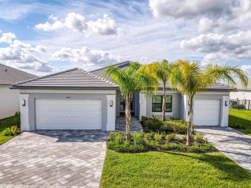 Front exterior of a new home in , Port St. Lucie, FL, highlighting curb appeal (Image 22).