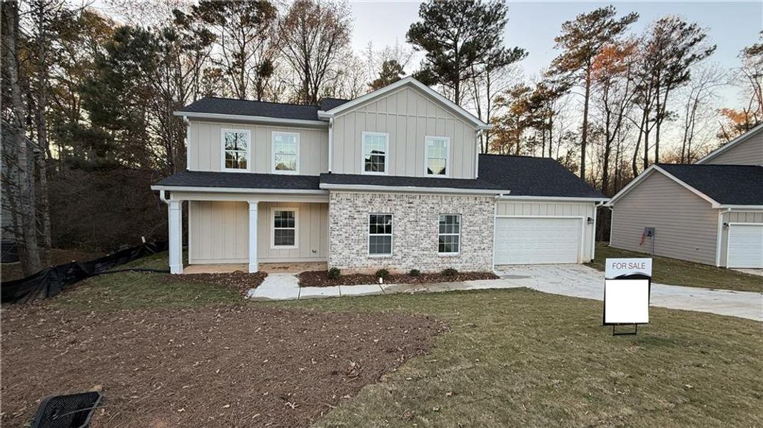 Front exterior of a new home in , Jonesboro, GA, highlighting curb appeal (Image 1). Front exterior of a new home in , Jonesboro, GA, highlighting curb appeal (Image 1).