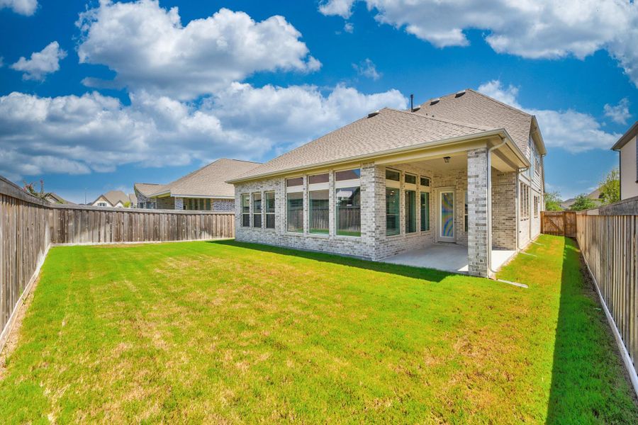 Exterior details and patio area of a home in Dunham Pointe - Enclave Collection, Cypress (Image 3).