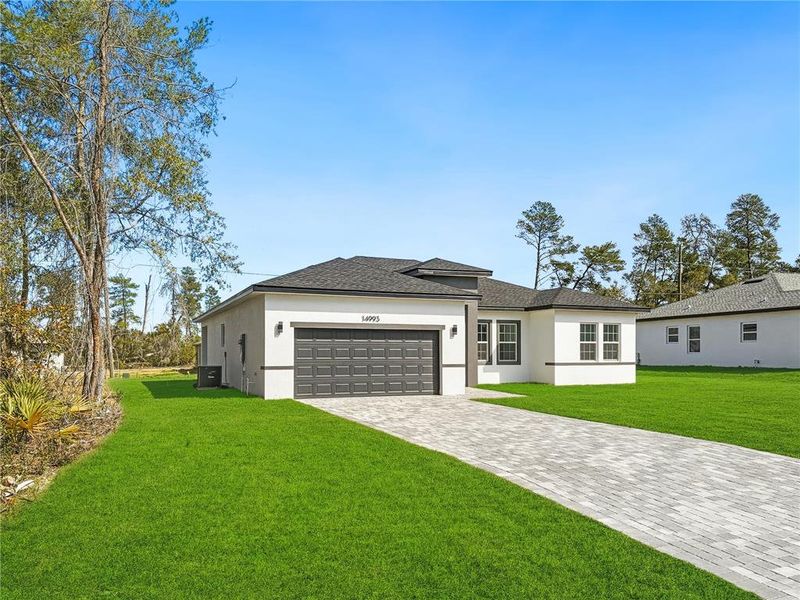 Front exterior of a new home in , Ocala, FL, highlighting curb appeal (Image 22).