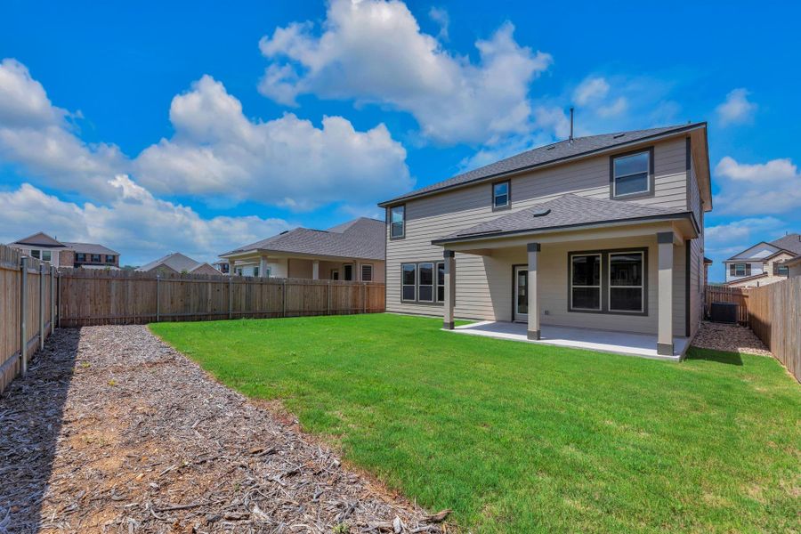 Front exterior of a new home in River Bluff, Leander, TX, highlighting curb appeal (Image 21). Front exterior of a new home in River Bluff, Leander, TX, highlighting curb appeal (Image 21).
