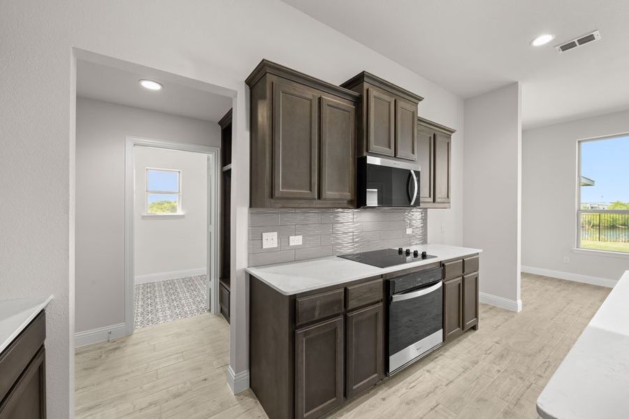 Front exterior of a new home in Still Water Lake, Godley, TX, highlighting curb appeal (Image 19). Front exterior of a new home in Still Water Lake, Godley, TX, highlighting curb appeal (Image 19).