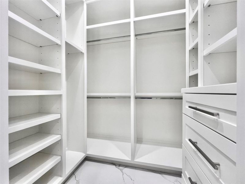 7'X5' His Walk-in California Style Closet with an Abundance of Custom built-in Drawers and Adjustable Shelves. 7'X5' His Walk-in California Style Closet with an Abundance of Custom built-in Drawers and Adjustable Shelves.