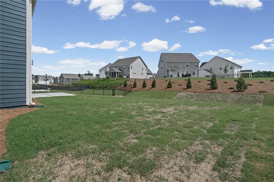 Exterior details and patio area of a home in Twin Lakes, Hoschton (Image 24).
