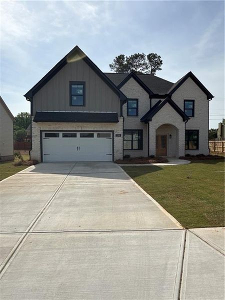 Front exterior of a new home in , Lawrenceville, GA, highlighting curb appeal (Image 27).
