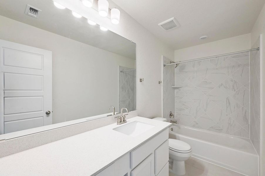 Furnished interior view inside a new home in Centerpoint Meadows, Lockhart (Image 5).