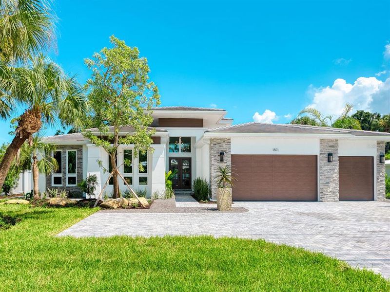 Front exterior of a new home in , Sarasota, FL, highlighting curb appeal (Image 23).