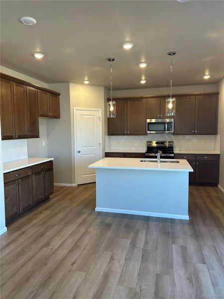 Furnished interior view inside a new home in The Legacy Collection at Talon Pointe, Thornton (Image 9).