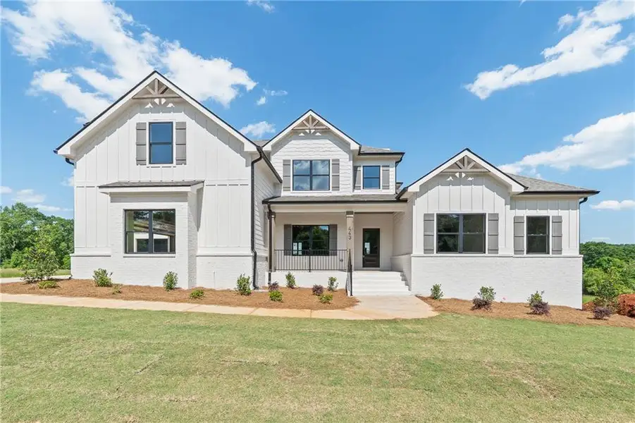 Front exterior of a home in the SteepleChase community, located in Hoschton, GA (Image 1).