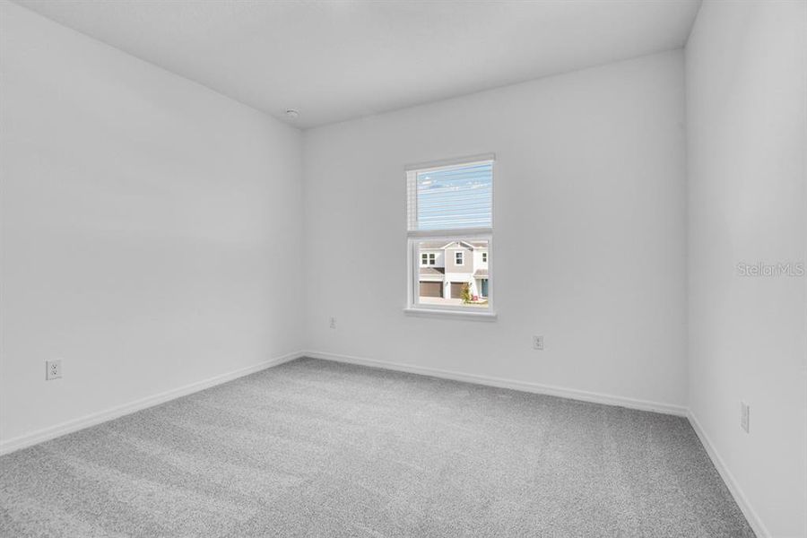 Spacious, unfurnished interior of a new home in Ardisia Park, New Smyrna Beach (Image 24).