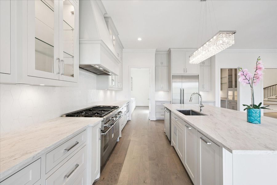 Impressive kitchen features Dolomite counters, soft-close cabinets and drawers and oversized island with Bar Seating. Impressive kitchen features Dolomite counters, soft-close cabinets and drawers and oversized island with Bar Seating.