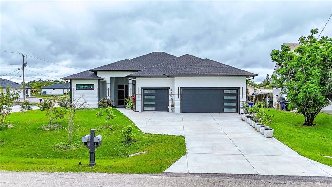 Front exterior of a new home in , Lehigh Acres, FL, highlighting curb appeal (Image 28).