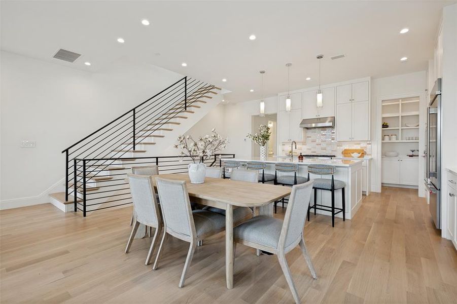Spacious second floor featuring wide-plank flooring and a dedicated dining area perfect for entertaining friends and family. Spacious second floor featuring wide-plank flooring and a dedicated dining area perfect for entertaining friends and family.
