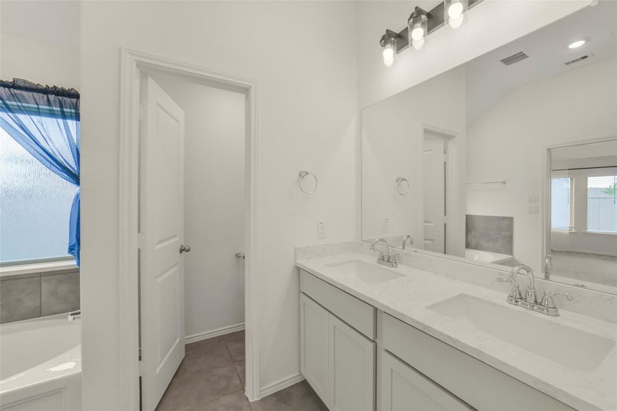 Furnished interior view inside a new home in Bridgeland, Cypress (Image 13).