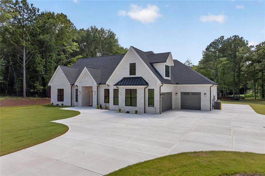 Front exterior of a new home in , Monroe, GA, highlighting curb appeal (Image 2). Front exterior of a new home in , Monroe, GA, highlighting curb appeal (Image 2).