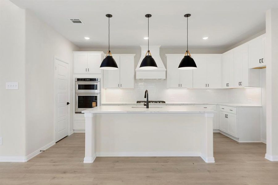 Beautiful cabinetry, lovely backsplash, gorgeous countertops, stainless appliances....what more could you ask for in your dream kitchen?