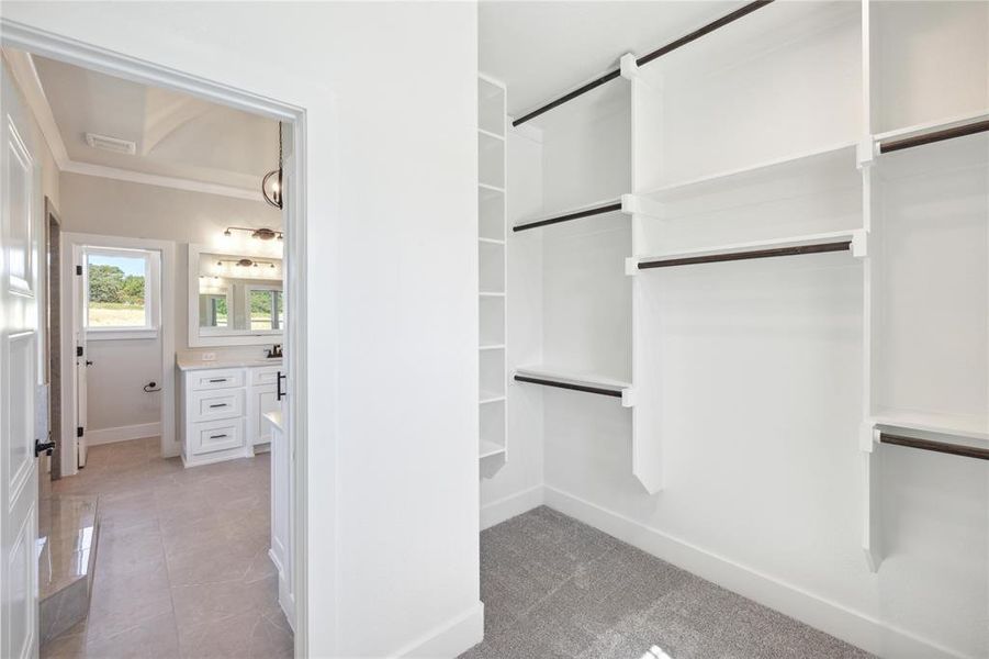 Walk in closet featuring light tile patterned floors