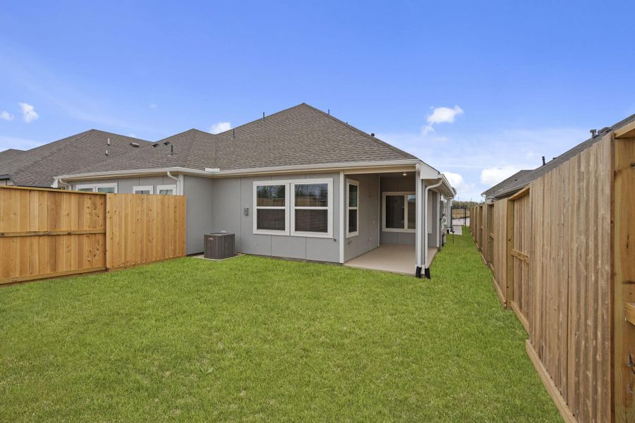 Exterior details and patio area of a home in Meridiana, Manvel (Image 3).
