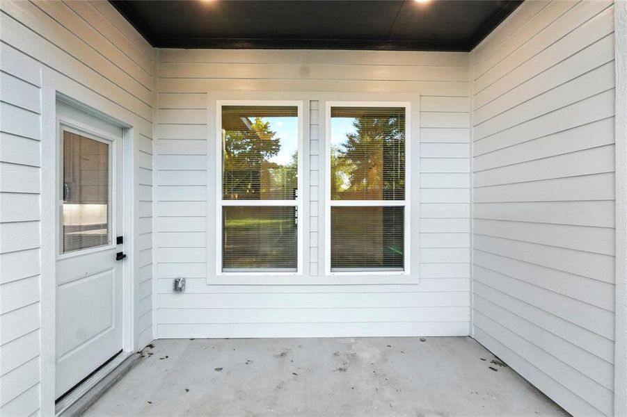 Entrance to property featuring a patio area