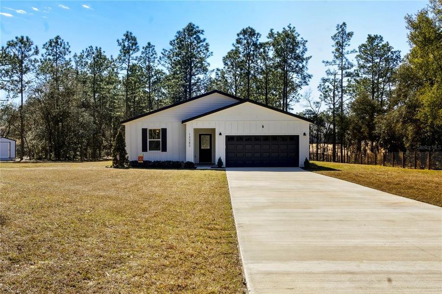 Front exterior of a new home in , Ocala, FL, highlighting curb appeal (Image 21).