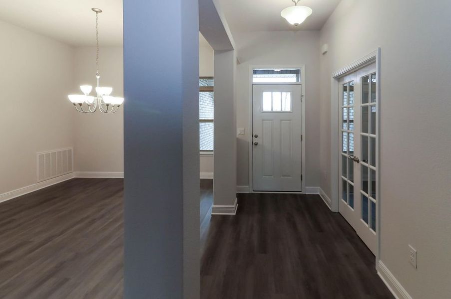 Representative unfurnished interior of a home built from the Plan 3044 by Adams Homes in Cedar Creek at Deerpoint Lake, Panama City (Image 10).