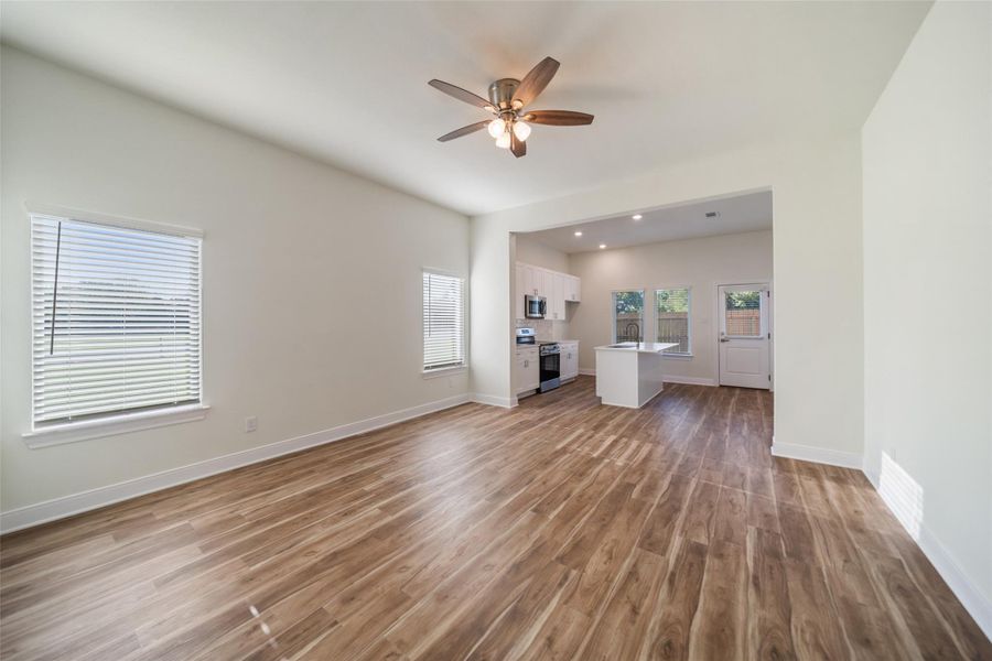View of living area and kitchen.