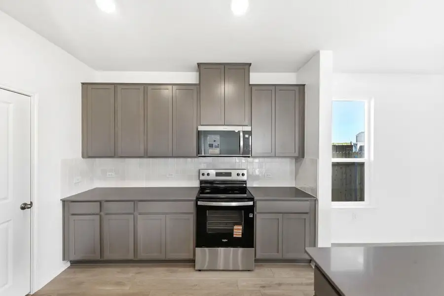 Furnished interior view inside a new home in Stoney Chase, Del Valle (Image 12).