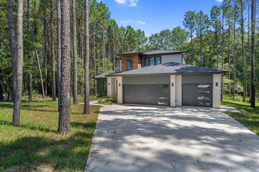 Front exterior of a new home in , Livingston, TX, highlighting curb appeal (Image 25).