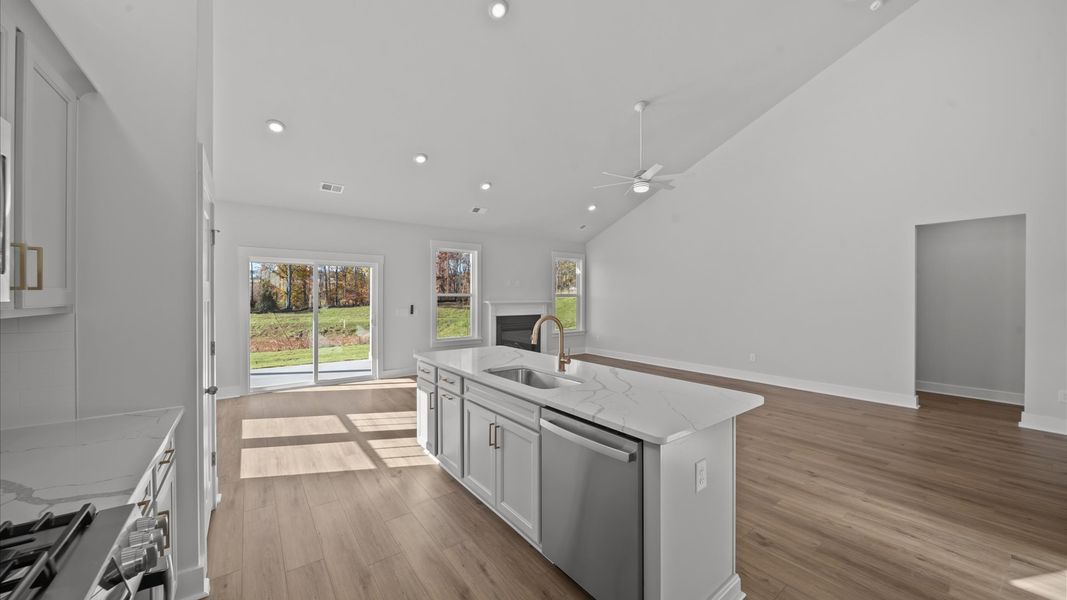 Vibrant kitchen layout with a center island, refined finishes, and open-concept flow