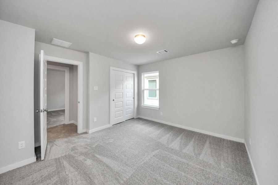 Generously sized secondary bedrooms featuring spacious closets, soft and inviting carpeting underfoot, large windows allowing plenty of natural light, and the added touch of privacy blinds for your personal retreat. Generously sized secondary bedrooms featuring spacious closets, soft and inviting carpeting underfoot, large windows allowing plenty of natural light, and the added touch of privacy blinds for your personal retreat.