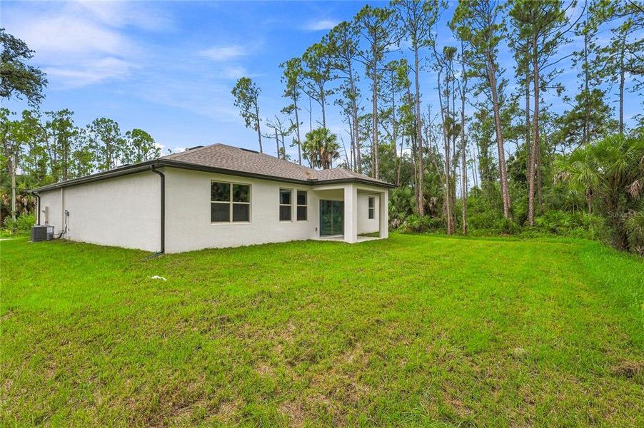 Exterior details and patio area of a home in , North Port (Image 24).