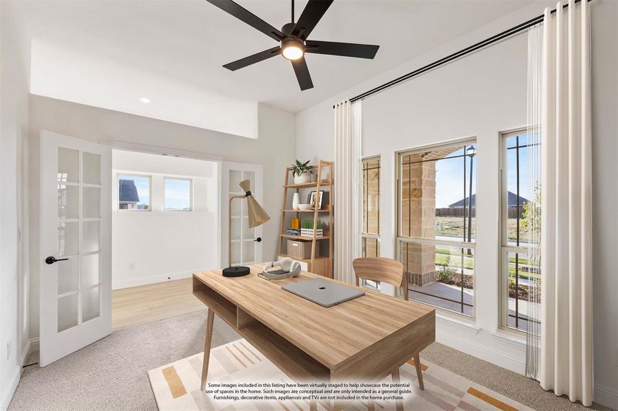 Home office with wood desk, ceiling fan, large windows, and French doors leading to adjacent room Home office with wood desk, ceiling fan, large windows, and French doors leading to adjacent room