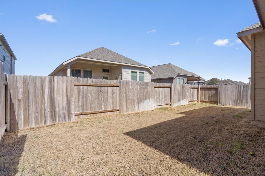 View of fenced backyard