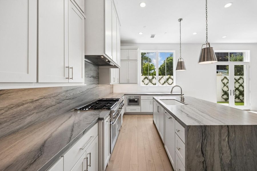Welcome to 5 Wentworth Green Way! This stunning home with spacious floorplan is your perfect place to call home. Natural light fills all three floors of this spectacular new construction.